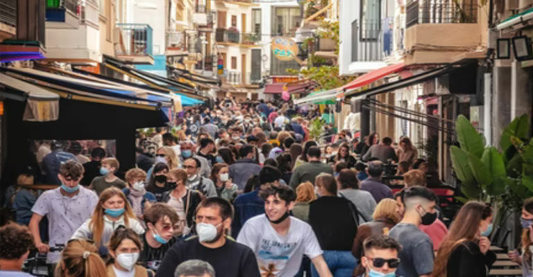 Crowd of people with masks on. COVID-19