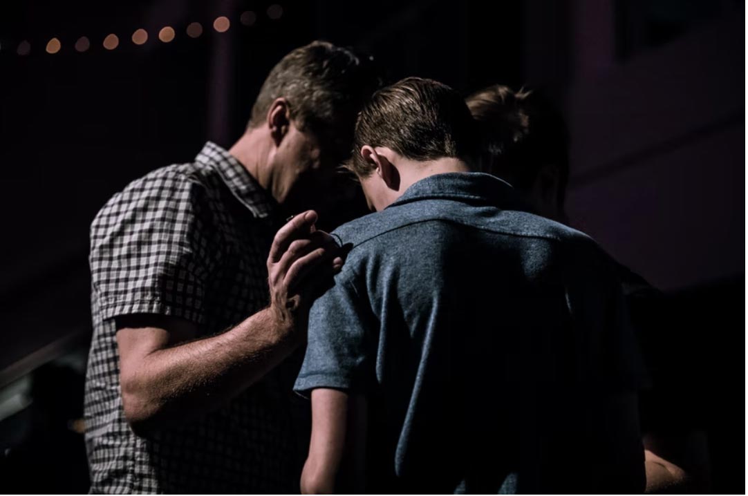 Group of guys praying