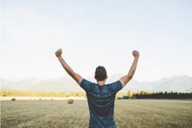 Man with his arms raised